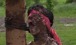 Elise Graves bondaged and covered in mud